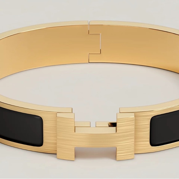 Hermes Men’s Gold and Black clickclack bracelet - Picture 1 of 9